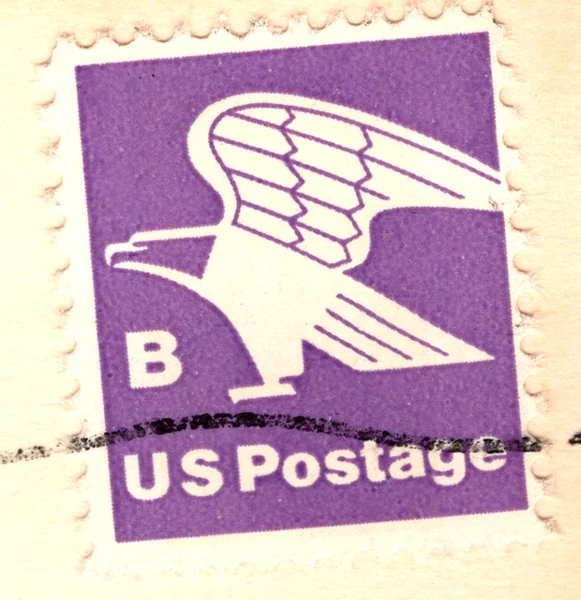 A non-denominated violet B-rate Eagle stamp (18 cents) on a postcard, from the Postcard Origins collection