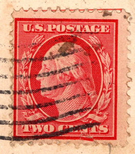 A 2-cent carmine George Washington stamp of the Washington-Franklin series on a postcard, postmarked 1911, from the Postcard Origins collection